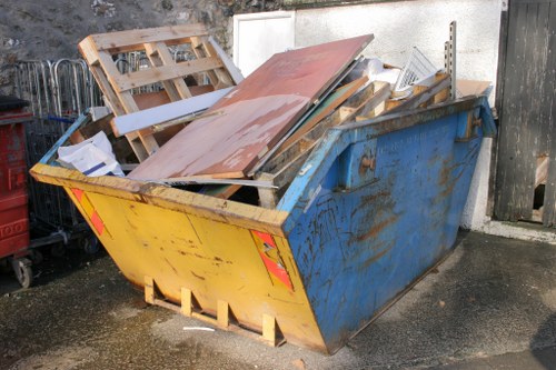 Crew member performing a safety check on a rubbish collection vehicle